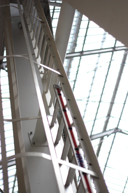 a metal fire escape staircase with a large window