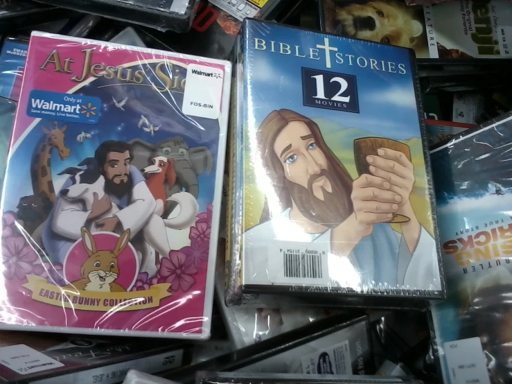the dvd cases are piled on top of each other