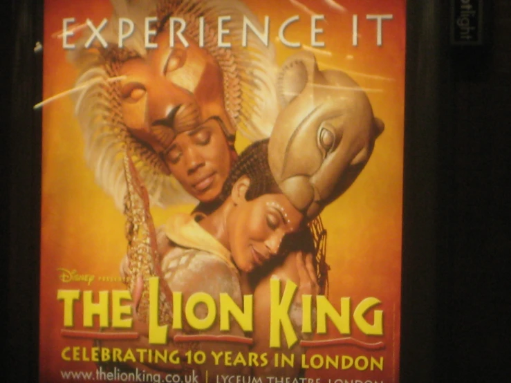 the poster for the lion king is displayed on a wall