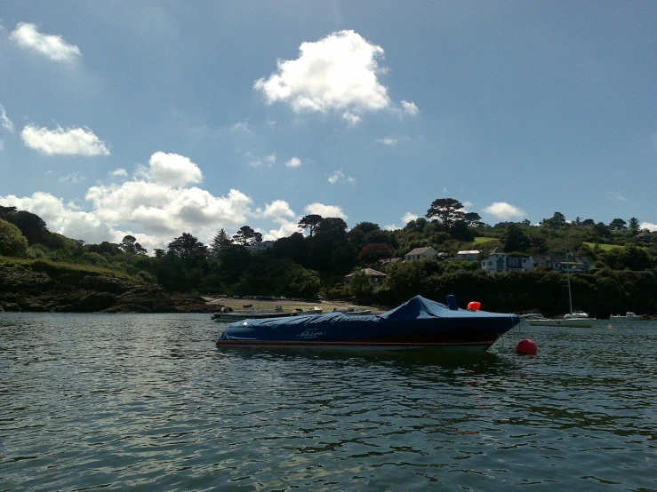 a boat out on the water with some people sitting on it