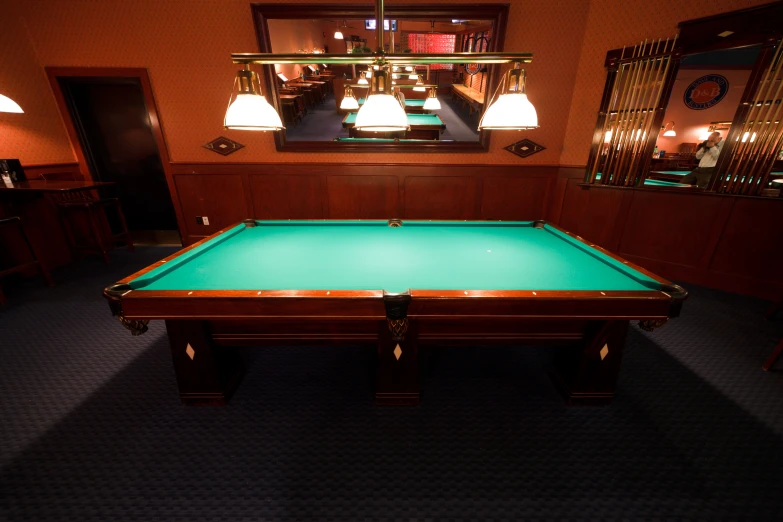 a pool table that is very nice and green