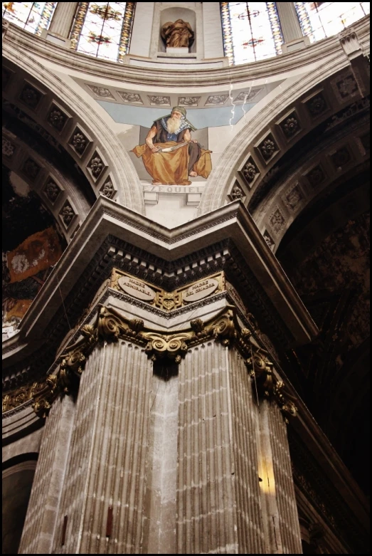 the inside view of a church with a very high ceiling