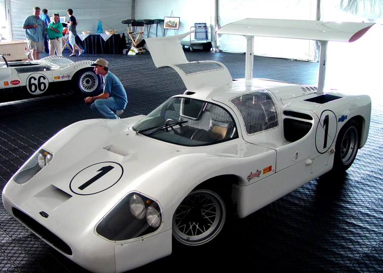 a car on display with people around it