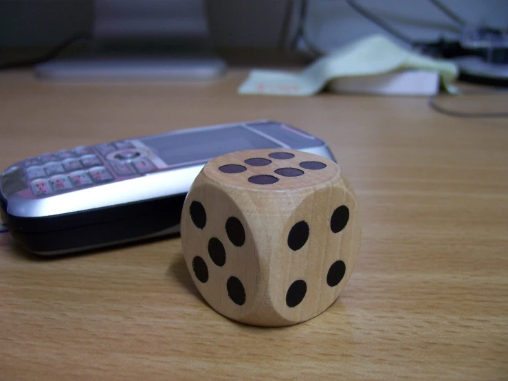 a dice that is sitting on the table