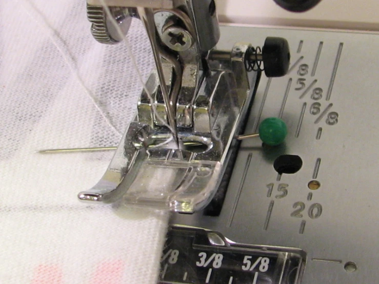 a sewing machine with some thread on it