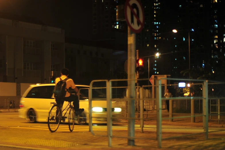 an image of man on bicycle at night