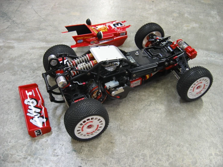 a toy racing car on a flat floor