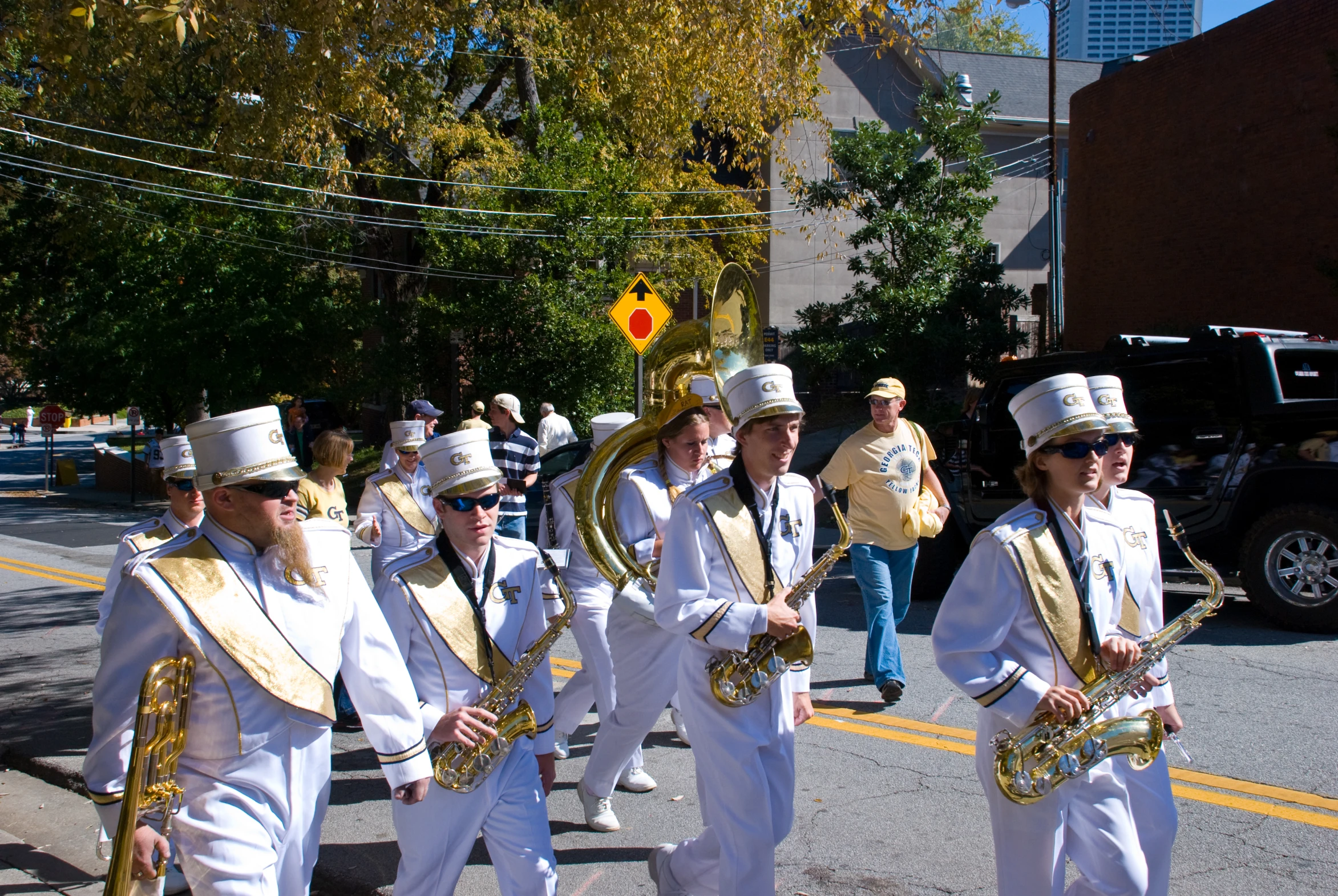 a parade of people marching down a street