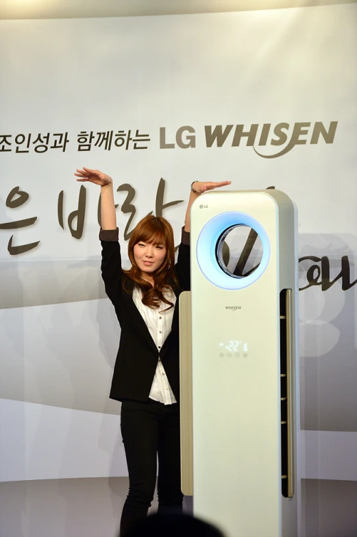 woman in black suit showing off her lg device