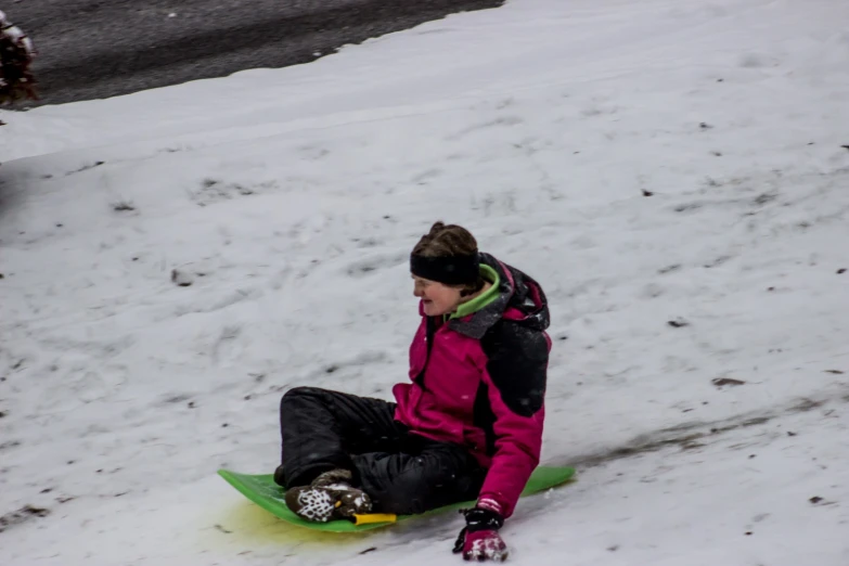 a person on skis sitting in the snow