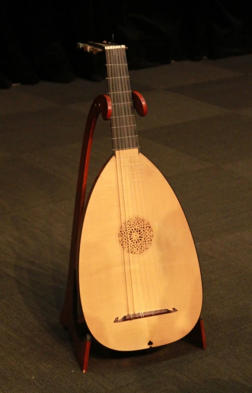 a wooden harp with its neck turned around