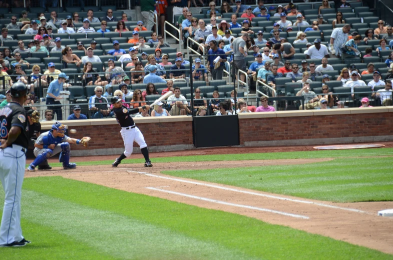 people watching a professional baseball game in progress