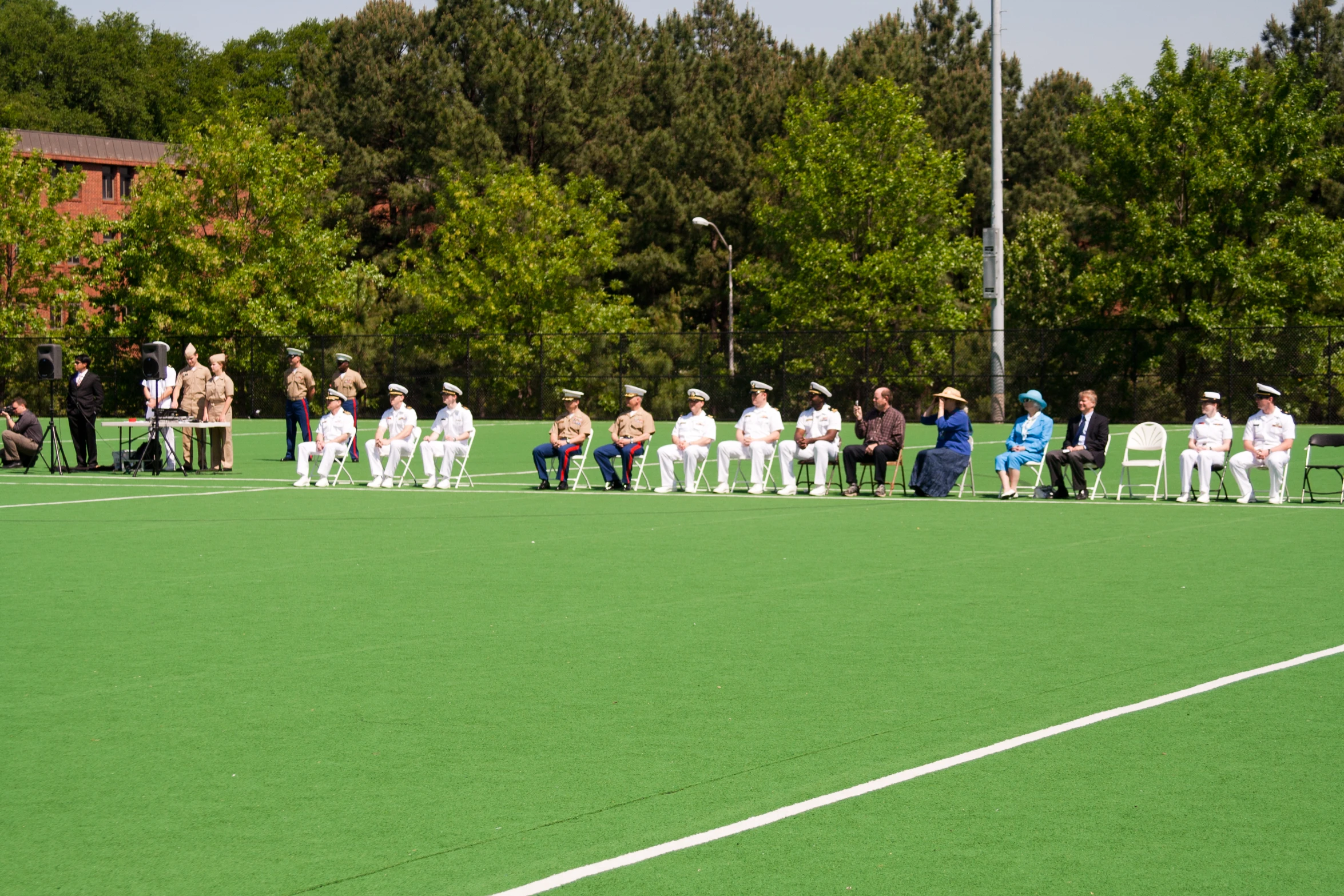 a crowd of people sitting on chairs watching a game