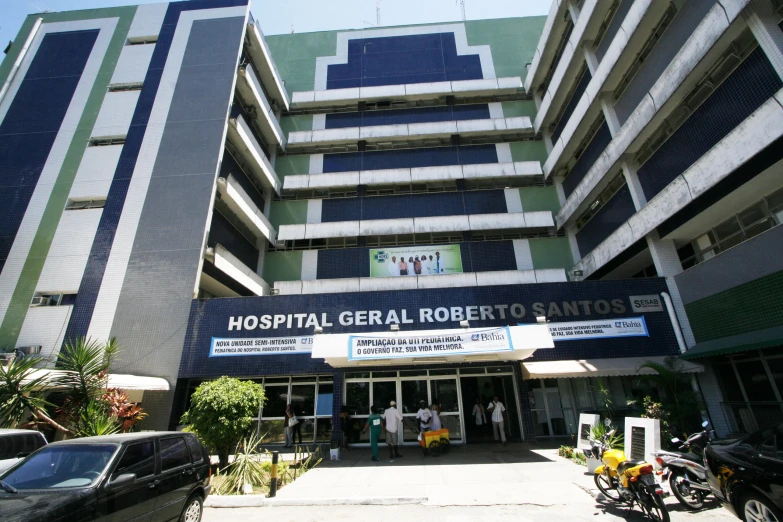 a group of cars parked in front of a hospital