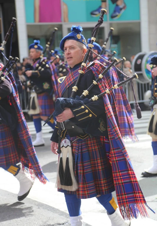 a band is performing in the street for spectators