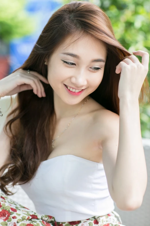 a young asian woman wearing an elegant white dress