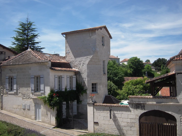 a couple of old buildings near a road