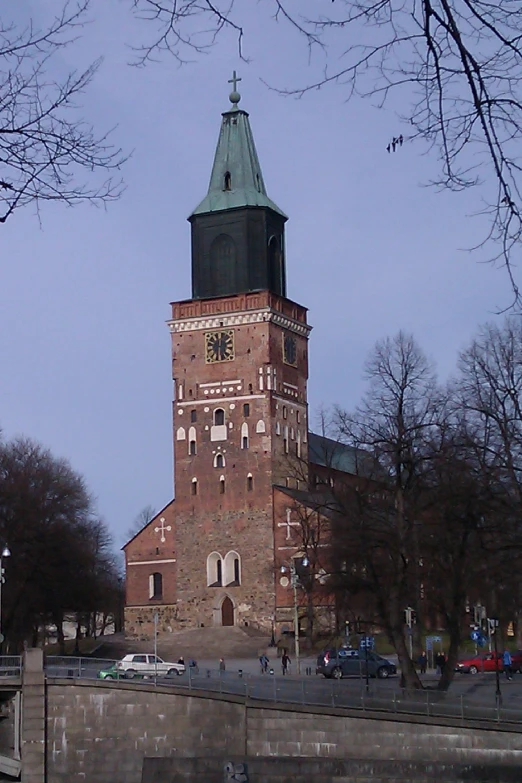 an old brick tower with a clock at the top