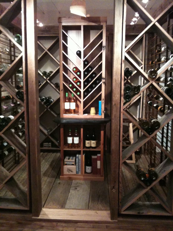 the wine rack is set up next to the empty bottle
