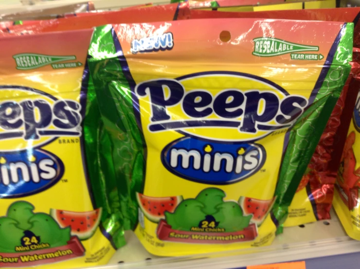 peeps are lined up on a supermarket shelf