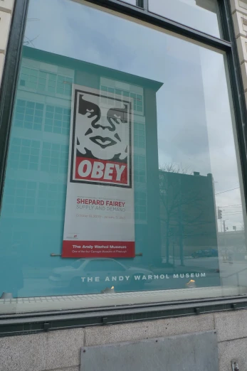 the entrance to the movie the andy warhol museum, with the large advertit on the wall