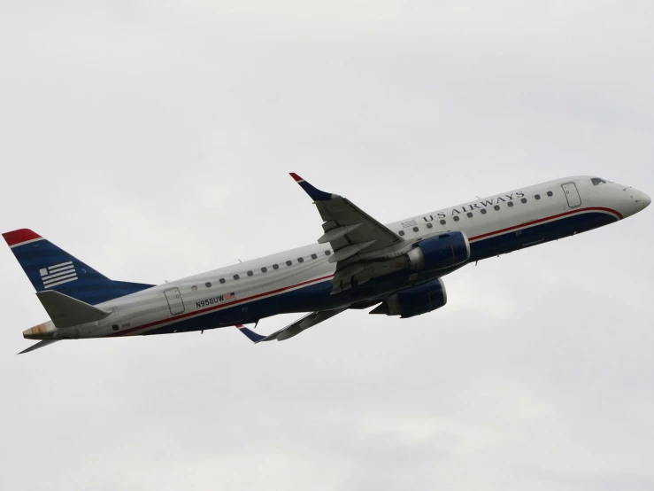 a passenger jet in the sky against a grey background