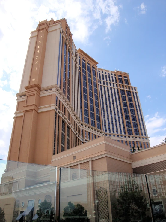 a large building next to a very tall building