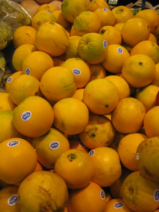 a display of lemons for sale at a grocery store