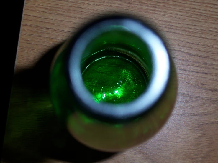 a glass cup sitting on top of a wooden table