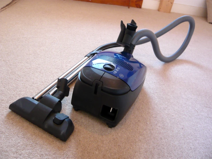 vacuums and vacuum cleaners on the floor of a room