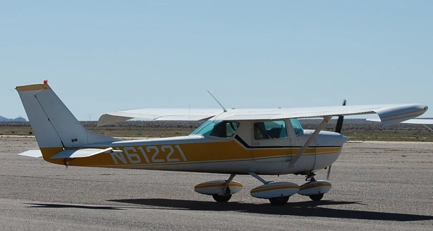 an airplane sits in a stationary position on the runway