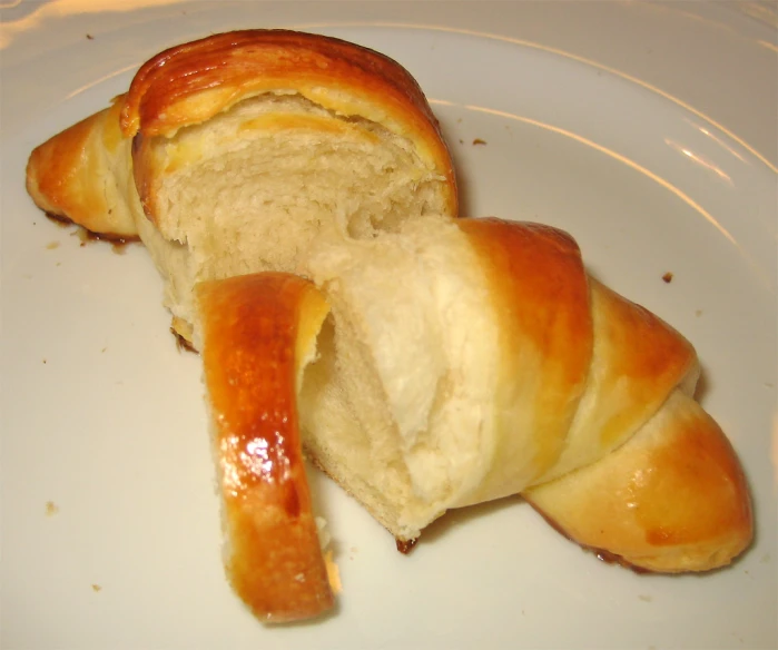 a roll of bread with a bite taken out of it