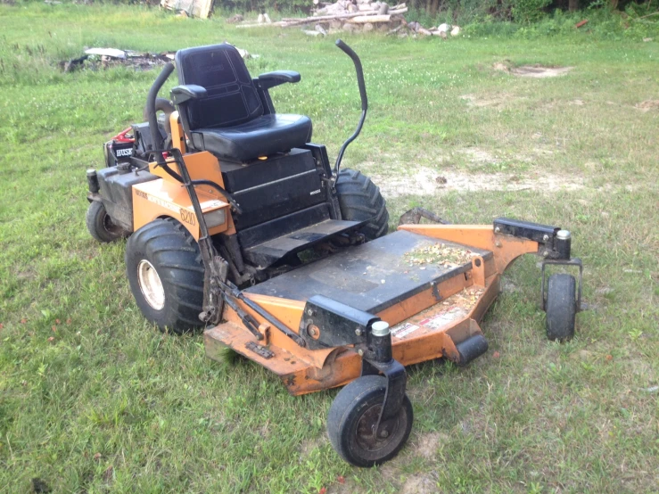 a man is in a yard  the grass with his lawn mower