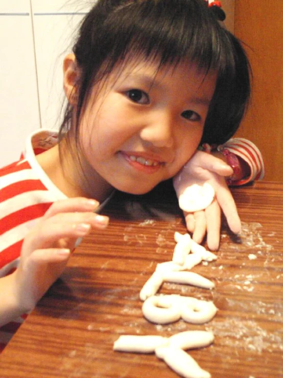 a  sitting in front of the table