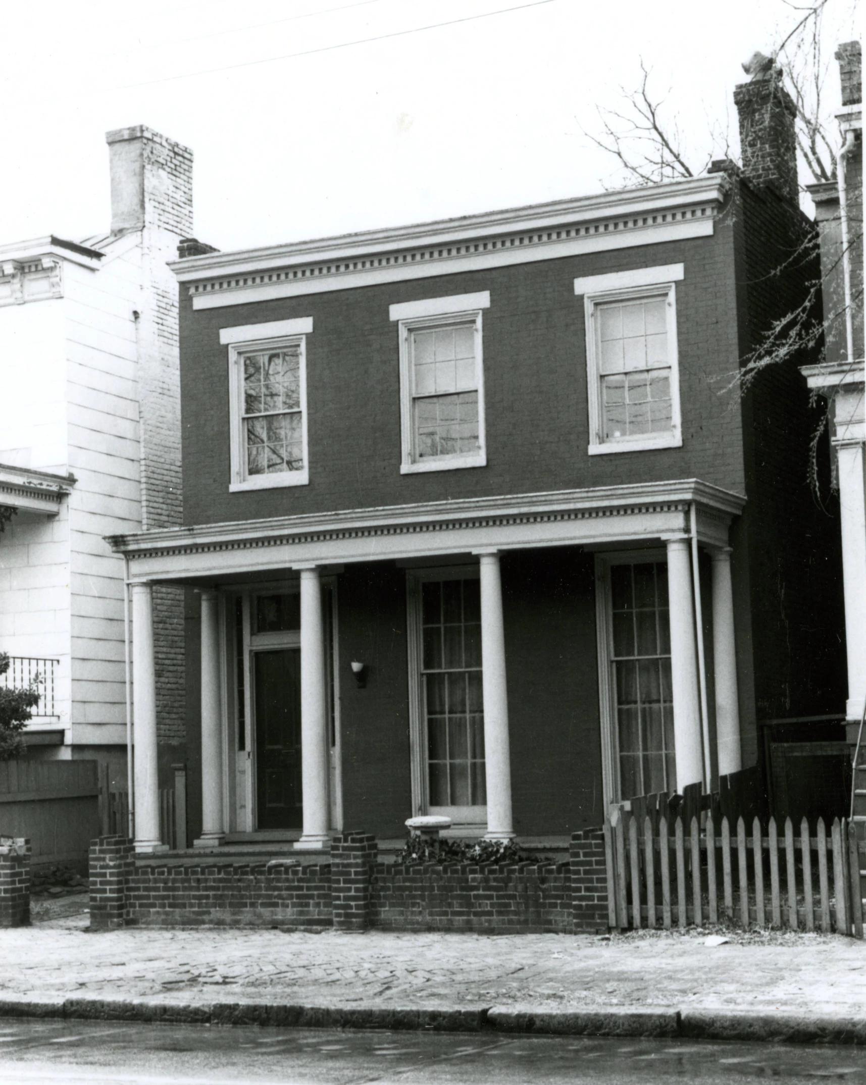 an old black and white pograph of a house