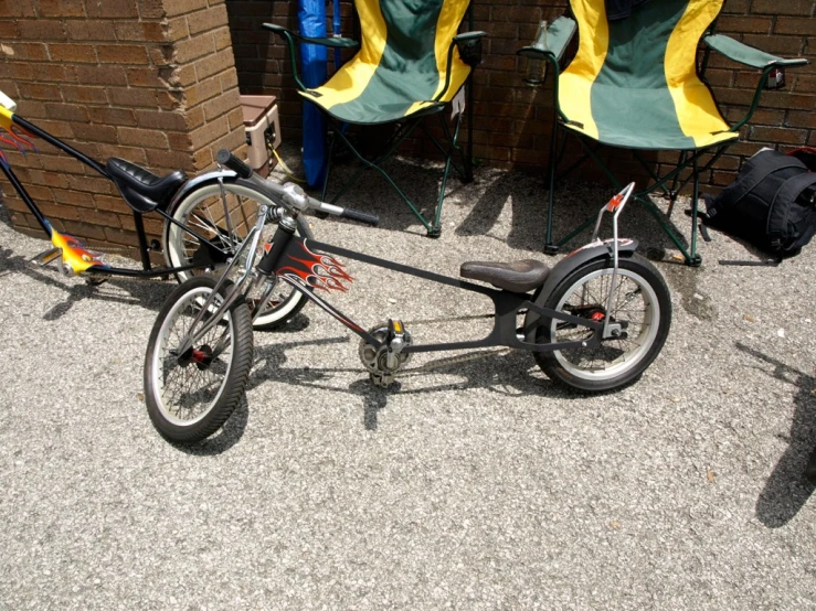 a bike with a seat on a gravel floor