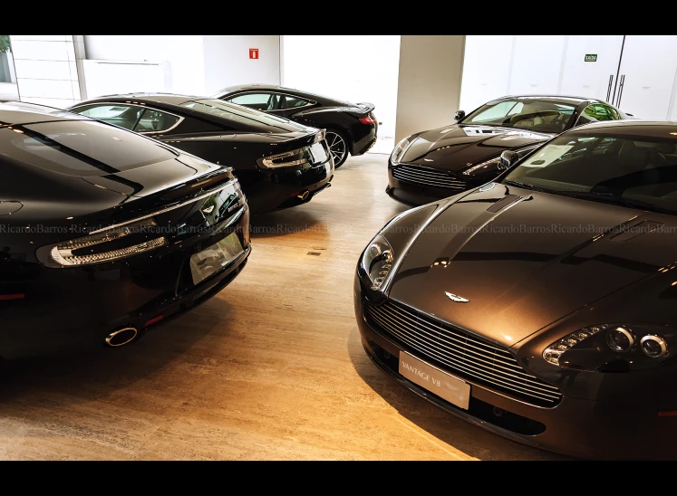 several different vehicles parked in an office building