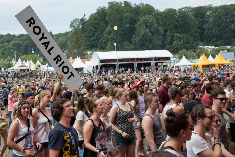 a crowd of people is gathering and having some fun