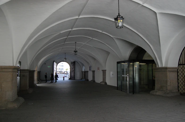 a corridor with a light hanging on the ceiling