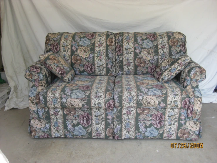 a colorful patterned couch sitting in a room