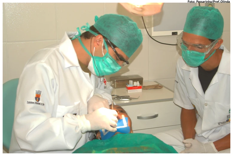 a dentist doing a procedure on the mouth of a patient