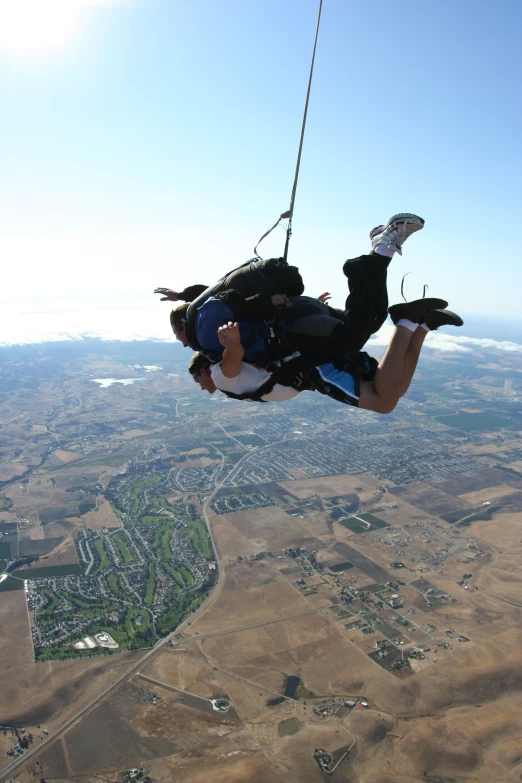 a man is zipping in the air with a parachute