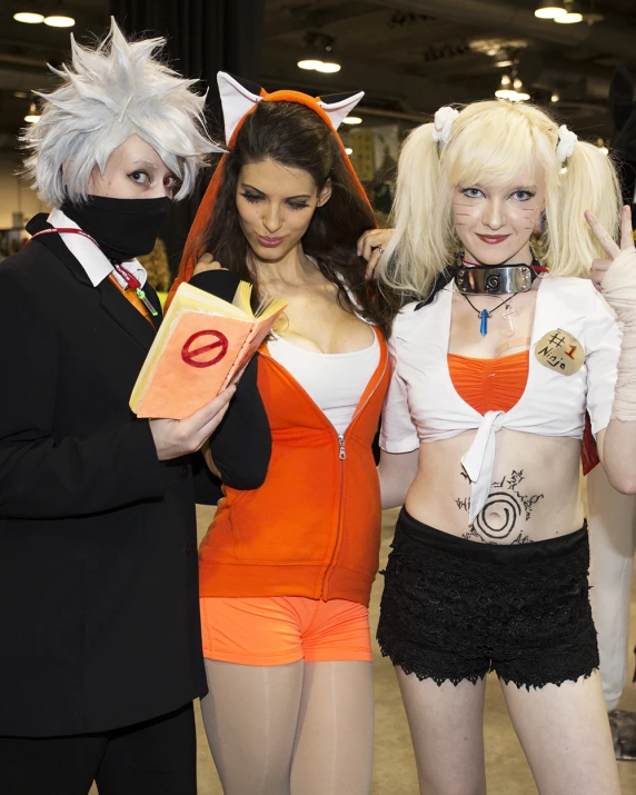 three female cosplayers standing in a store