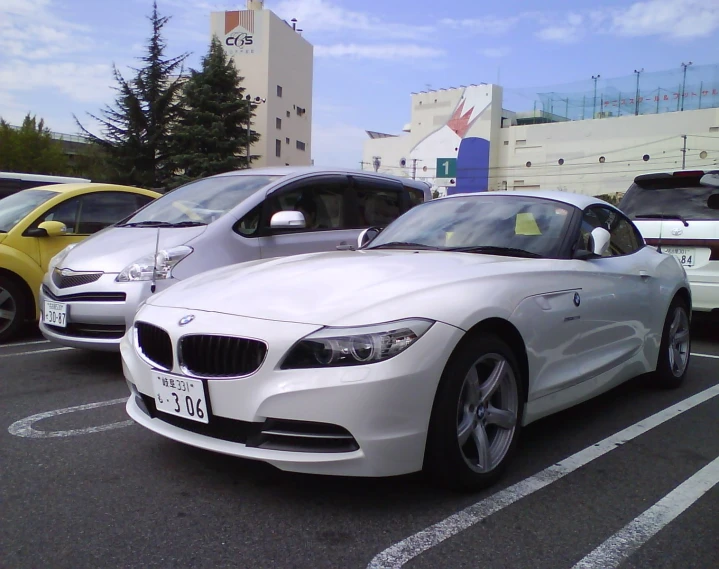 several cars are parked in a lot with no one inside