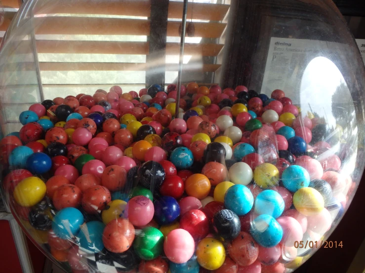 an image of a candy bowl filled with different colored balls