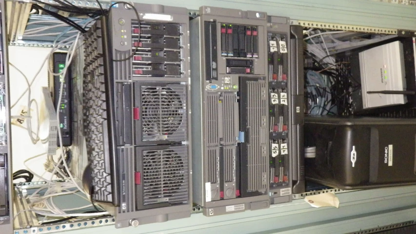 an array of computers and other items sitting in a row