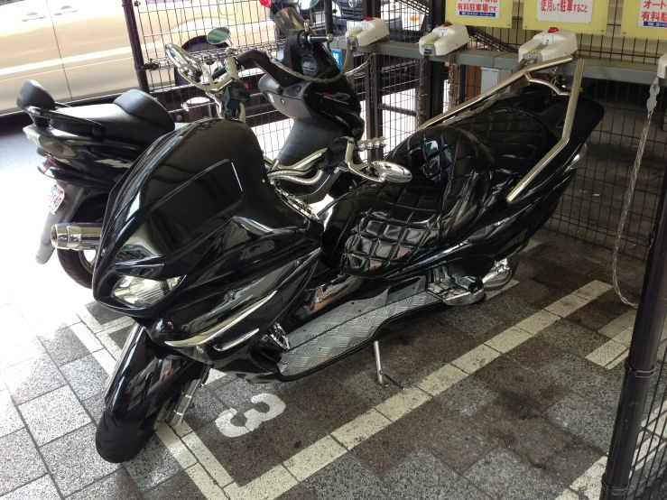 a parked motorcycle next to a parking garage