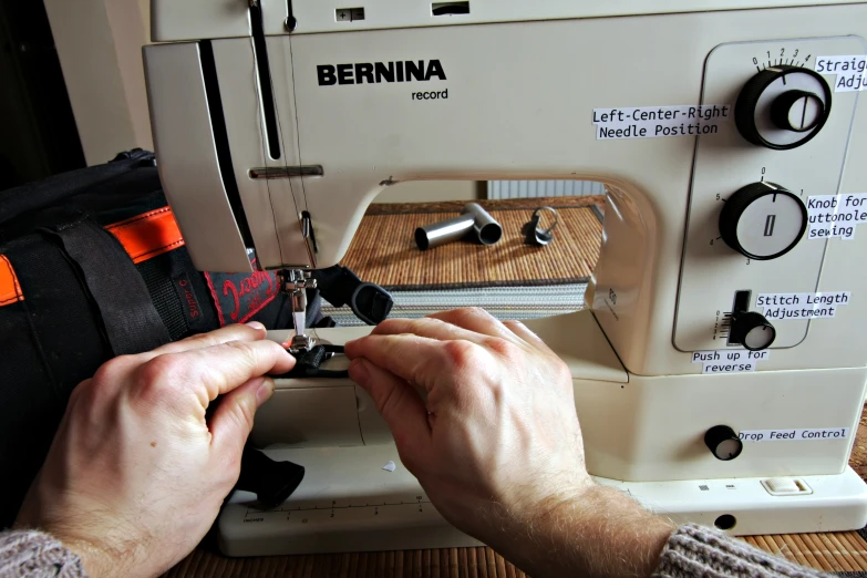 an image of a person sews soing with a sewing machine