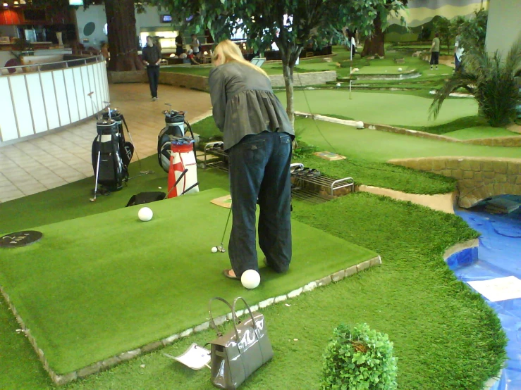 a man teeing off from a golf course