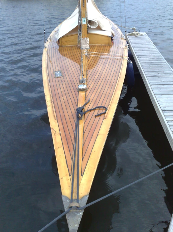 a boat docked at the end of a dock